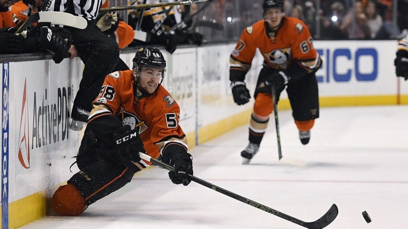 Anaheim Ducks left wing Nicolas Kerdiles passes the puck as he falls during the second period of the team's NHL hockey game against the Boston Bruins, Wednesday, Feb. 22, 2017, in Anaheim, Calif. (AP Photo/Mark J. Terrill)