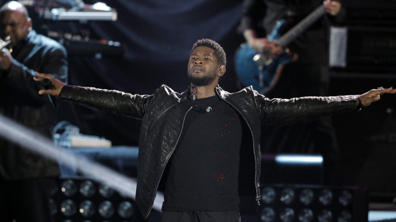 Musician Usher performs at the "A Decade of Difference" concert at the Hollywood Bowl in Los Angeles, Saturday, Oct. 15, 2011. The concert is part of “Decade of Difference” weekend, which celebrates 10 years of the William J. Clinton Foundation. (AP Photo/Matt Sayles)