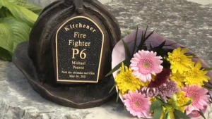 A helmet with Michael Pearce's name on it has been added to the Fallen Firefighter Memorial in Kitchener. (Tyler Kelaher/CTV Kitchener)