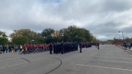 Under cloudy skies, officers of all services assembled in front of the Saskatchewan Legislative Building on Sept. 24, 2023. (Hallee Mandryk/CTV News)