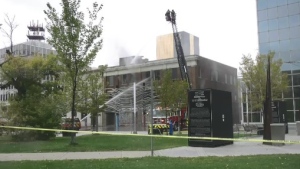 Fire crews can be seen spraying water on the Gordon Block building in downtown Regina. (Hallee Mandryk/CTV News)