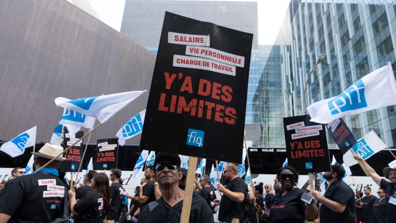 FILE: Quebec health-care workers and members from the Quebec’s nurses union (FIQ) demonstrate to demand a new contract negotiation in Montreal, Wednesday, Sept. 6, 2023. THE CANADIAN PRESS/Christinne Muschi
