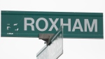 A sign for Roxham road is shown near the Canada/US border in Hemmingford, Que., Saturday, March 25, 2023. THE CANADIAN PRESS/Graham Hughes