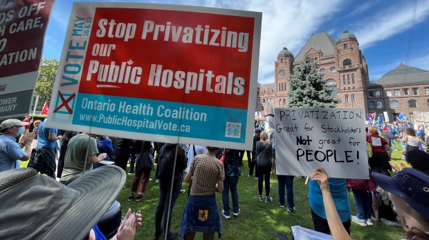 Protesters are shown outside Queen's Park on Monday afternoon. Thousands are expected to partake in a demonstration against the further privatization of healthcare in Ontario. (Beth Macdonell)