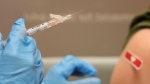 Pharmacist Kim Nguyen prepares to administer a Moderna Spikevax COVID-19 vaccine at a CVS, Wednesday, Sept. 20, 2023, in Cypress, Texas. (Melissa Phillip/Houston Chronicle via AP)