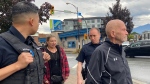 Chilliwack, B.C., resident Robert Amede Freeman, right, is confronted outside court after making an appearance on two counts of second-degree murder. 