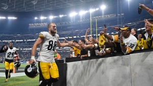 Pittsburgh Steelers tight end Pat Freiermuth shakes hands with fans as he walks off the field after a win over the Las Vegas Raiders in an NFL football game Sunday, Sept. 24, 2023, in Las Vegas. (AP Photo/David Becker)