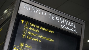 An indication sign at Gatwick Airport, in London, Monday, Aug. 2, 2021. (AP Photo/Alberto Pezzali, File)