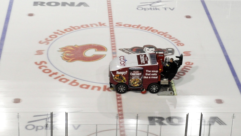 The ice surface is cleaned at an empty Scotiabank Saddledome in Calgary, Alta., home of the NHL's Calgary Flames, on Sunday, Jan. 6, 2013. THE CANADIAN PRESS/Larry MacDougal