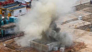 Smoke rises after a 100-kilogram Second World War-era aerial bomb is detonated at a construction site in Singapore on Sept. 26, 2023. (Photo by ROSLAN RAHMAN/AFP via Getty Images)