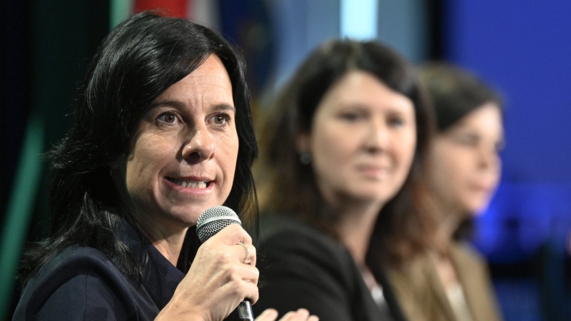 Montreal Mayor Valerie Plante speaks at a summit on unhoused people organized by the Quebec Union of Municipalities (UMQ), in Quebec City, Friday, Sept. 15, 2023. Gatineau mayor France Belisle, right, looks on. THE CANADIAN PRESS/Jacques Boissinot