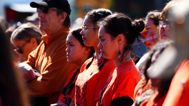 People take part in ceremonies for the National Day of Truth and Reconciliation in Ottawa on Friday, Sept. 30, 2022. THE CANADIAN PRESS/Sean Kilpatrick