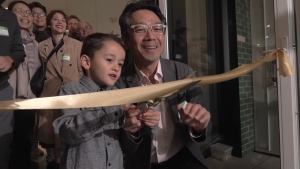 With the snip of a pair of large, shiny scissors, four-year-old Leo cut the ribbon to officially open Our Urban Village, the co-housing project where he lives with his parents. (CTV)