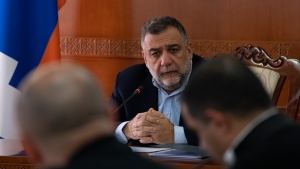 FILE - Ruben Vardanyan, the State Minister of Nagorno-Karabakh, also known as Artsakh leads a cabinet meeting in Stepanakert, the capital of the region of Nagorno-Karabakh, also known as Artsakh, on Tuesday, Jan. 3, 2023. Azerbaijan says Wednesday, Sept. 27 it has detained Vardanyan, the former head of Nagorno-Karabakh's separatist government, as he tried to cross into Armenia following Azerbaijan's 24-hour blitz last week to reclaim control of the enclave. (Edgar Harutyunyan/PAN Photo via AP, File)