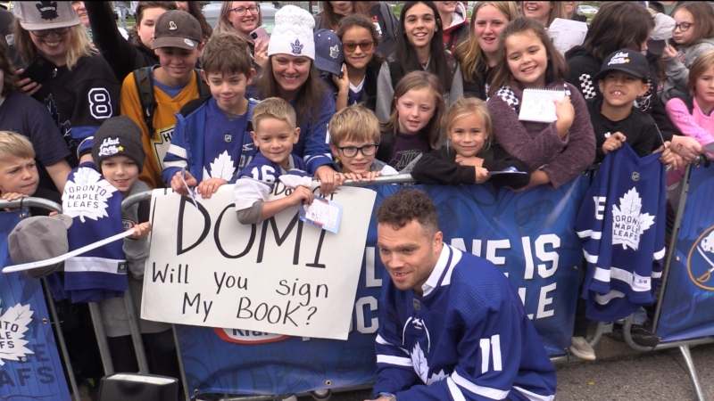Max Domi of the Toronto Maple Leafs poses for a photo with fans in St. Thomas, Ont. as part of the Kraft Hockeyville game on Wednesday, Sept. 27, 2023. (Brent Lale/CTV News London)