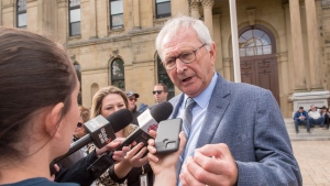 Premier Blaine Higgs speaks with media in front of the New Brunswick legislature in Fredericton, Wednesday, Sept. 20, 2023. (THE CANADIAN PRESS/Stephen MacGillivray)