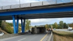 Police were diverting southbound traffic at the Royal Oak Drive exit after the truck flipped under at the Quadra Street overpass. (Saanich police)