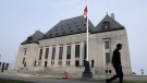 A man walks past the Supreme Court of Canada, Friday, June 16, 2023 in Ottawa. THE CANADIAN PRESS/Adrian Wyld
