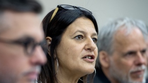 Coroner Gehane Kamel, centre, speaks during a news conference in Montreal, Thursday, May 19, 2022. The sister of one of the victims of a Montreal-area shooting spree in August 2022 told Kamel today she lives with a tremendous amount of grief at the loss of her younger brother.THE CANADIAN PRESS/Graham Hughes
