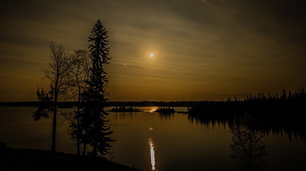 Moon over Knee Lake. Photo by Wayne Boychuk.