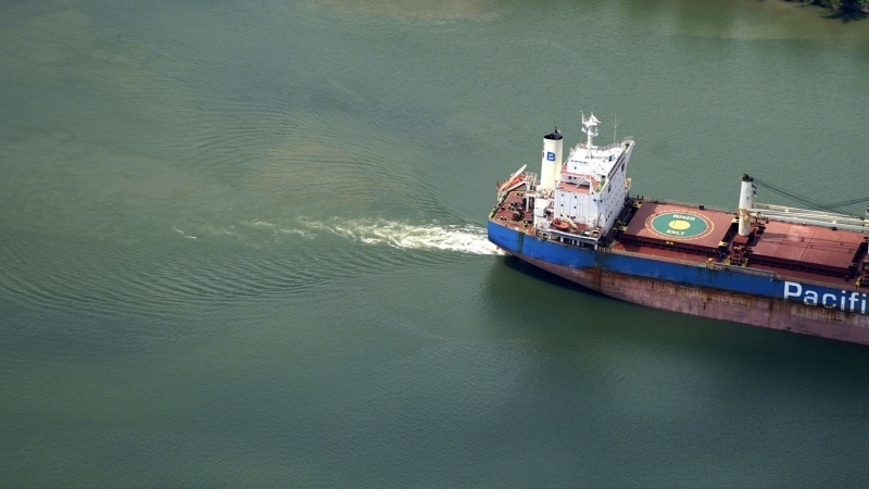 In this aerial photo, sediment and mixed river water is seen as a tanker ship moves upriver in Plaquemines Parish, La., Tuesday, Sept. 26, 2023. A salt water wedge slowly moving upriver from the Gulf of Mexico, due to the unusually low water level in the river, may threaten municipal water supplies, potentially even New Orleans. (AP Photo/Gerald Herbert)