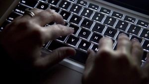 The federal government is coping with apparent cyber attacks this week, as a hacker group in India claims it has sowed chaos in Ottawa. Hands type on a keyboard in Vancouver on Wednesday, December, 19, 2012. THE CANADIAN PRESS/Jonathan Hayward