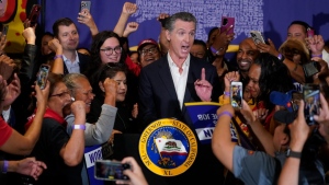 California Gov. Gavin Newsom signs the fast food bill surrounded by fast food workers at the SEIU Local 721, Sept. 28, 2023, in Los Angeles, Calif. (AP Photo/Damian Dovarganes)