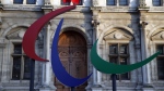 The logo of the Paris 2024 Paralympic Games is pictured in front of the Paris town hall, France, Friday, Nov. 10, 2017. (AP Photo/Christophe Ena, File)