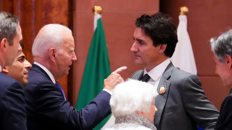 Prime Minister Justin Trudeau and U.S. President Joe Biden speak as they arrive to take part in a working session at the G20 Summit in New Delhi, India on Saturday, Sept. 9, 2023. THE CANADIAN PRESS/Sean Kilpatrick