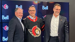 Steve Staios wears a Senators jersey as he is introduced as the new president of Hockey Operations for the Ottawa Senators. Staios is joined by Senators general manager Pierre Dorion (left) and owner Michael Andlauer. (Dylan Dyson/CTV News Ottawa) 