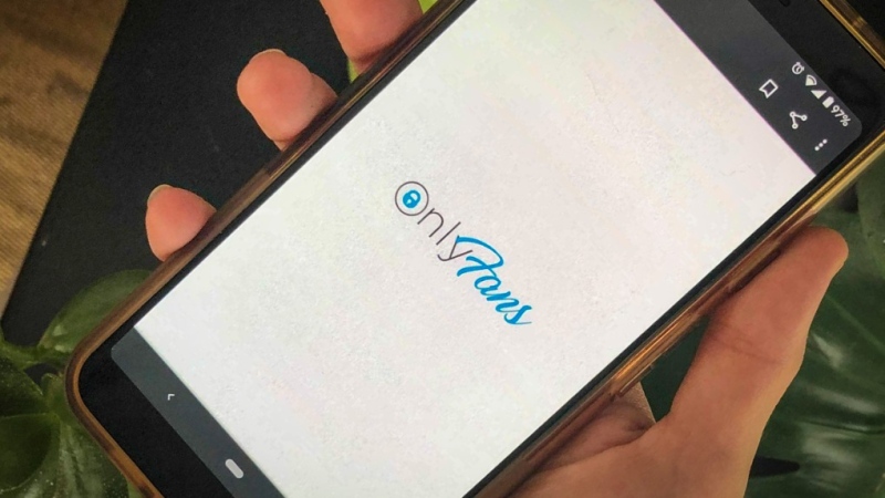 This photo shows a phone app for OnlyFans, a site where fans pay creators for their photos and videos, Thursday Aug. 19, 2021. OnlyFans says it has “suspended” a plan to ban sexually explicit content following an outcry from its creators and advocates for sex workers. The company tweeted Wednesday, Aug. 25, 2021 that it had “secured assurances necessary to support our diverse creator community” and will “continue to provide a home for all creators.” (AP Photo/Tali Arbel, file)