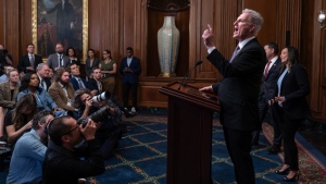 Speaker of the House Kevin McCarthy, R-Calif., pauses as he addresses reporters about efforts to pass appropriations bills and avert a looming government shutdown, at the Capitol in Washington, Friday, Sept. 29, 2023. He is joined at right by House Homeland Security Chair Mark Green, R-Tenn., and Rep. Monica de la Cruz, R-Texas. (AP Photo/J. Scott Applewhite)