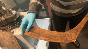 David Foster Carter showing off the blade of what is believed to be the oldest Mi'kmaq hockey stick. (CTV/Paul Hollingsworth)