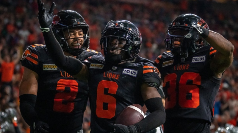 BC Lions Josh Woods (2), T.J. Lee (6) and Quincy Mauger (36) celebrate after an interception in the end zone against the Saskatchewan Roughriders during second half of CFL football action in Vancouver, B.C., Friday, Sept. 29, 2023. THE CANADIAN PRESS/Ethan Cairns
