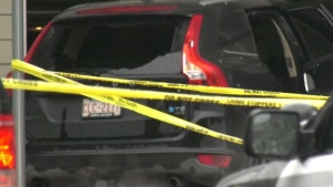 A car with smashed out windows and a man with gunshot wounds were found at a condominium building Saturday in Seaton. (CTV News Calgary)