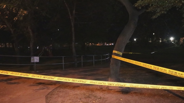 Police tape is scene at a park in Etobicoke following a stabbing.
