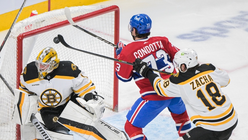 Montreal Canadiens' Lucas Condotta (73) scores against Boston Bruins goaltender Jeremy Swayman as Bruins' Pavel Zacha defends during first period NHL hockey action in Montreal, Thursday, April 13, 2023. THE CANADIAN PRESS/Graham Hughes