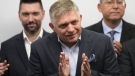 Chairman of Smer-Social Democracy party Robert Fico, center, adresses the results of an early parliamentary election during a press conference in Bratislava, Slovakia, Sunday, Oct. 1, 2023. (AP Photo/Darko Bandic)