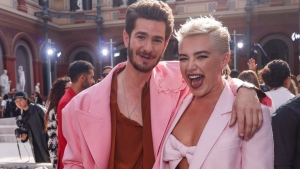 Andrew Garfield, left, and Florence Pugh attend the Valentino Spring/Summer 2024 womenswear fashion collection presented Sunday, Oct. 1, 2023 in Paris. (AP Photo/Vianney Le Caer)