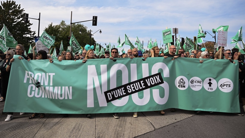 People take part in a public sector union demonstration in Montreal, Saturday, September 23, 2023. Members of several Quebec public-sector unions are continuing to vote in favour of strike mandates by large margins. THE CANADIAN PRESS/Graham Hughes
