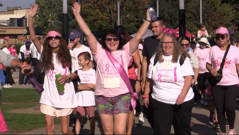 Cancer Survivor Katherine Butson raises her hands as she starts the CIBC Run for the Cure at Victoria Park in London, Ont. on Sunday, Oct. 1, 2023. (Brent Lale/CTV News London)