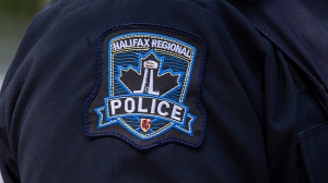 A Halifax Regional Police emblem is seen as police officers attend a murder scene in Halifax on Thursday, July 2, 2020. (THE CANADIAN PRESS/Andrew Vaughan)