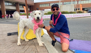 Stacy Halonen and his dog Eddie taking part in Sudbury's annual CIBC Run for the Cure to support a family member who is a breast cancer survivor. (Alana Everson/CTV News Northern Ontario)