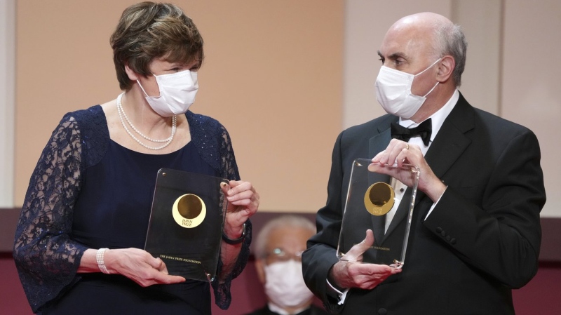 Japan Prize 2022 laureates Hungarian-American biochemist Katalin Kariko, left, and American physician-scientist Drew Weissman, right, pose with their trophies during the Japan Prize presentation ceremony Wednesday, April 13, 2022, in Tokyo. (AP Photo/Eugene Hoshiko, Pool, File)