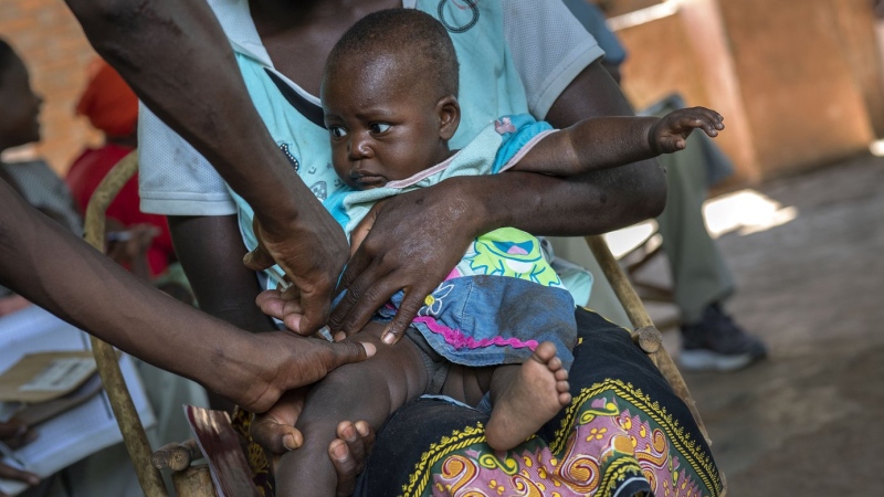 A baby from the Malawi village of Tomali is injected with the world's first vaccine against malaria in a pilot program, on Dec. 11, 2019. (AP Photo/Jerome Delay, File)