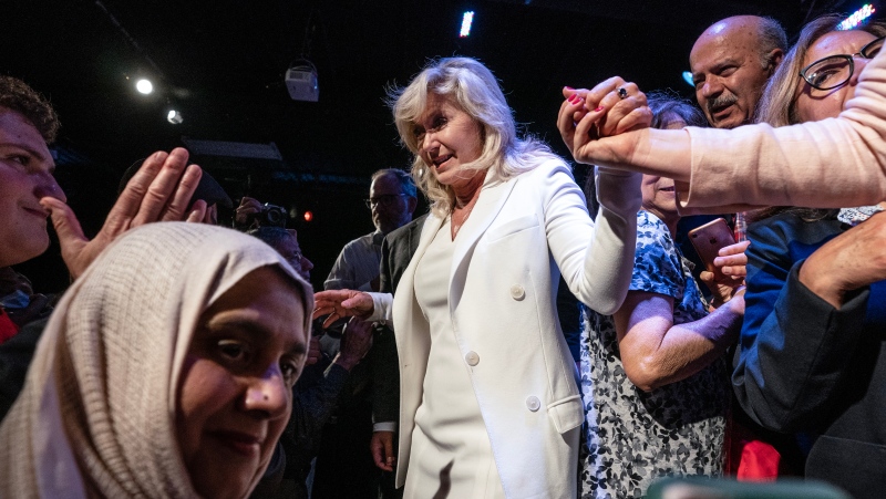 Mississauga Mayor Bonnie Crombie is helped off the stage after a rally in Mississauga, Ont. on Wednesday June 14, 2023, in which she announced her Ontario Liberal Leadership candidacy. THE CANADIAN PRESS/Chris Young