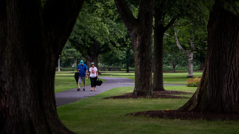 People make their way along Commissioners Park in Ottawa on Sunday, July 24, 2022 (Spencer Colby/THE CANADIAN PRESS)
