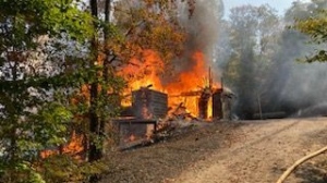 Cottage in Muskoka in flames (courtesy, Muskoka Lakes Fire Department)