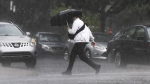 A pedestrians runs through a rainstorm Thursday, July 13, 2023 in Montreal. THE CANADIAN PRESS/Ryan Remiorz
Ryan Remiorz
