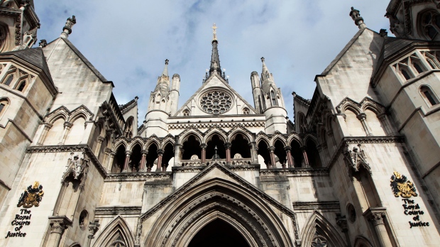 A view of the exterior of the Royal Courts of Justice, which houses the High Court, in London, on Wednesday, Oct. 3, 2012. Britain's government acted unlawfully when it routinely housed newly arrived unaccompanied child asylum seekers in hotels, the High Court ruled Thursday, July 27, 2023.(AP Photo/Sang Tan, File)